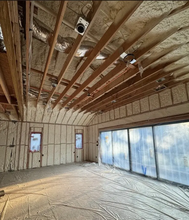 Interior walls and ceiling insulated with spray foam during new construction in Sherman